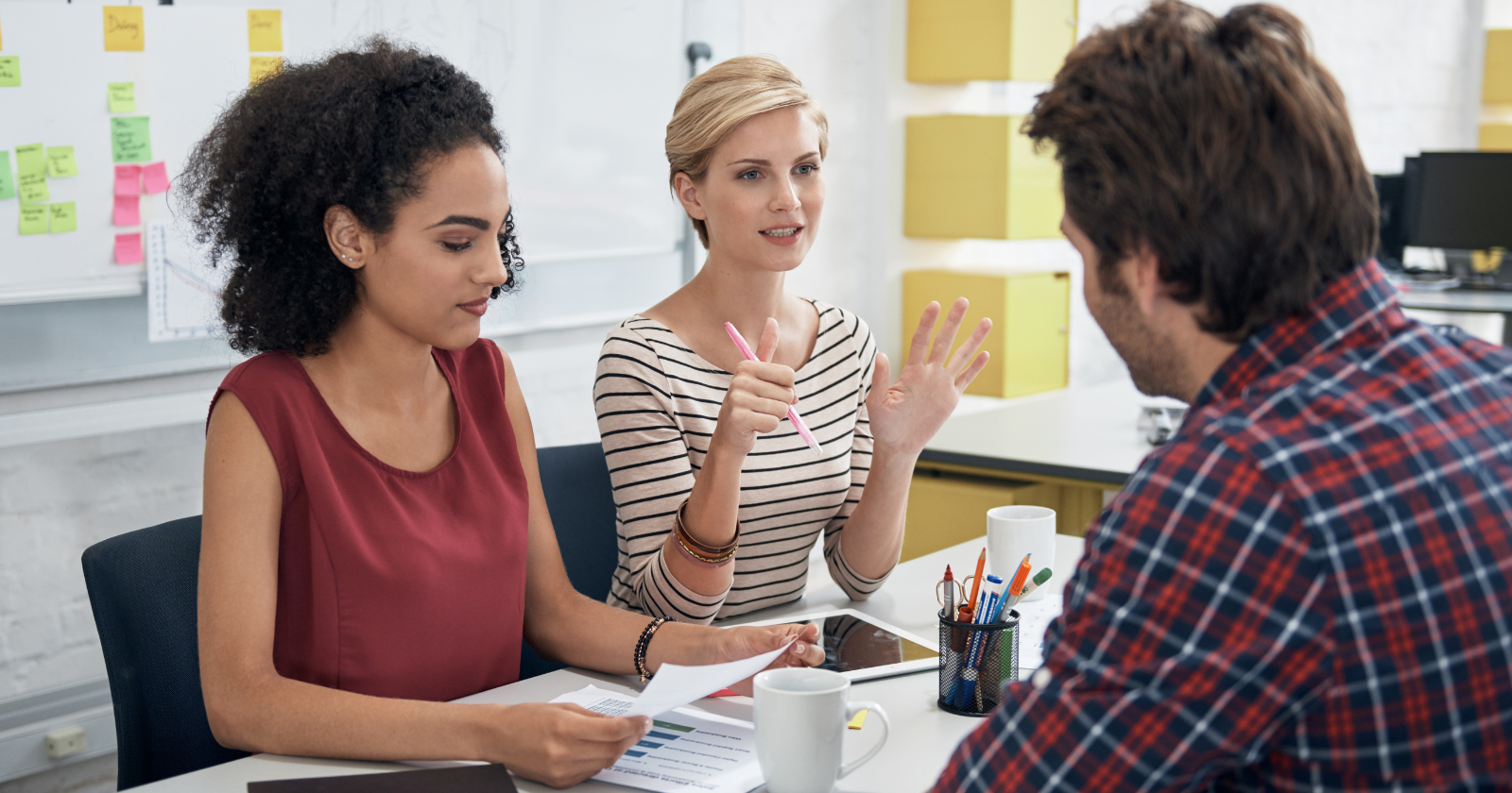 coworkers talking calmly to each other