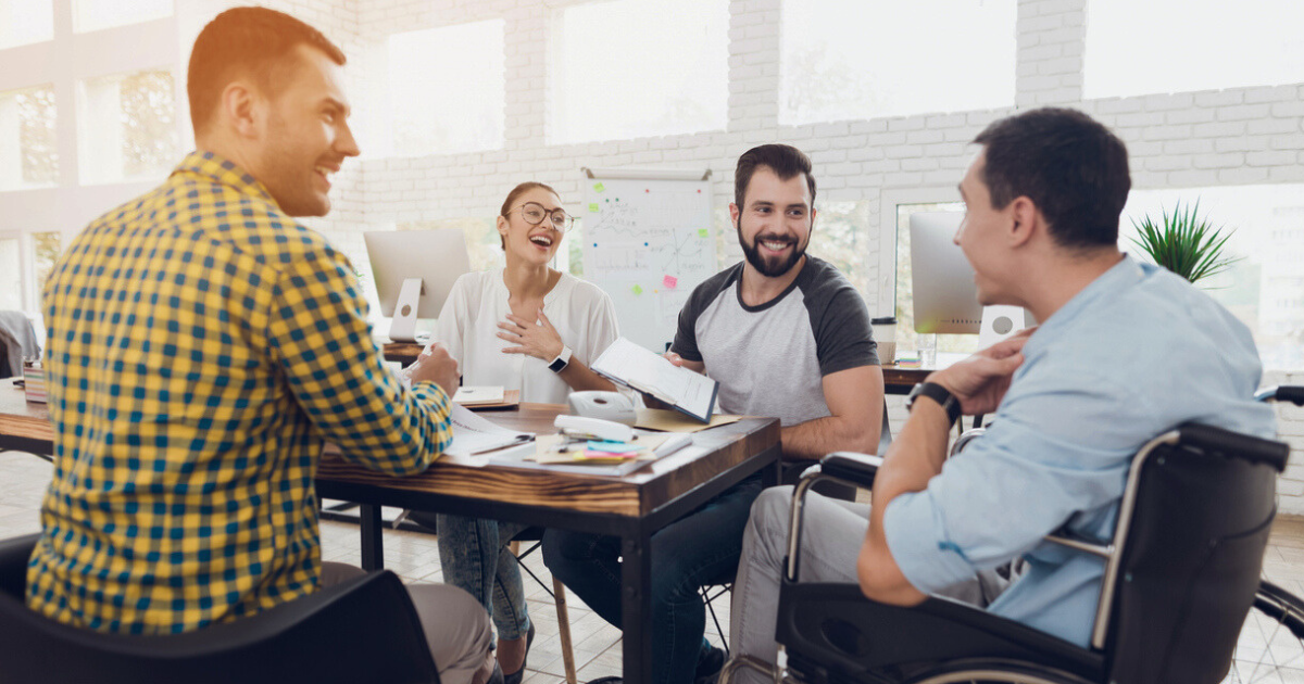 group of cheerful employees in a casual meeting