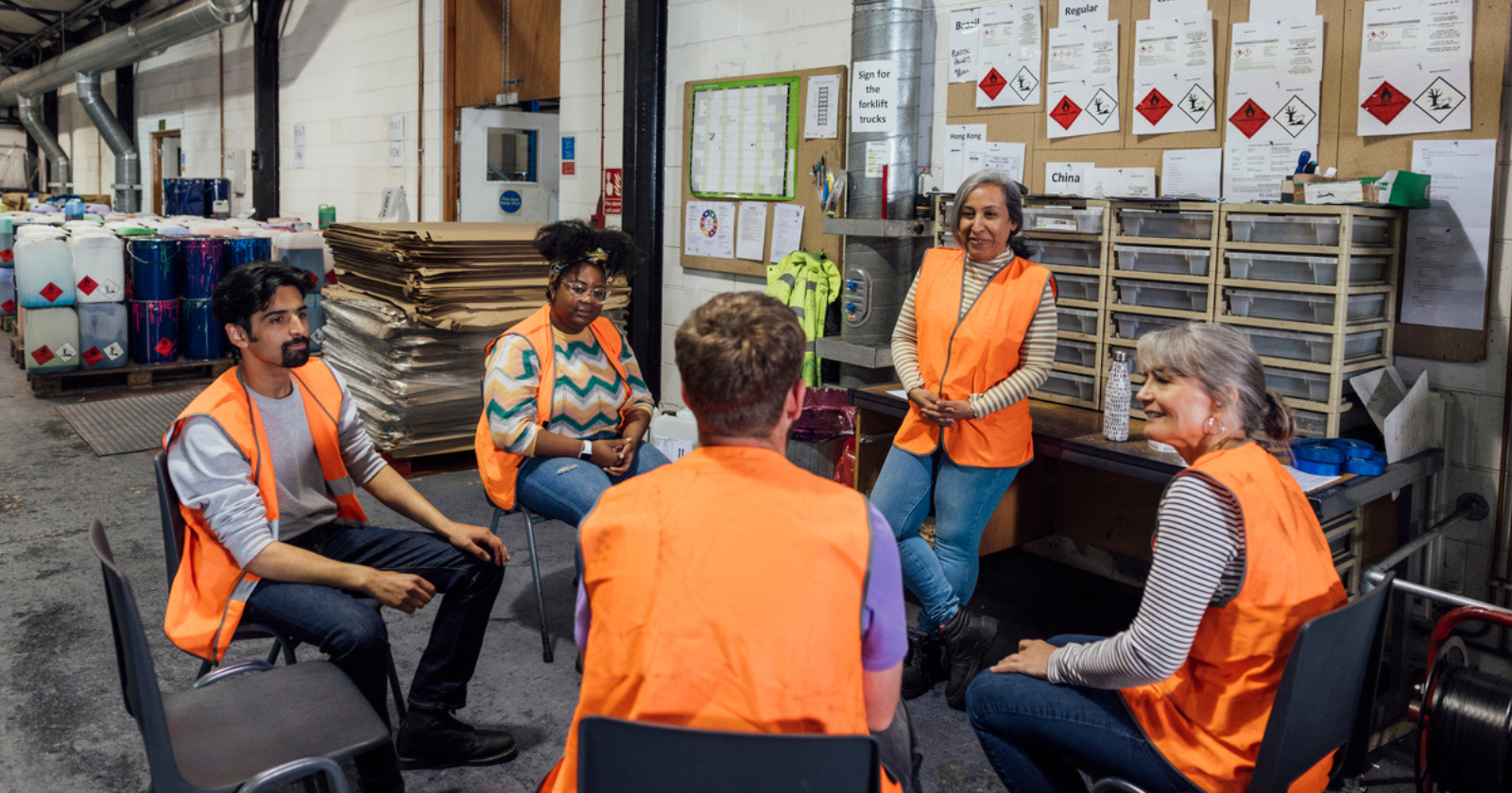 workers in a meeting facing each other