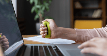 Executive holding a stress ball