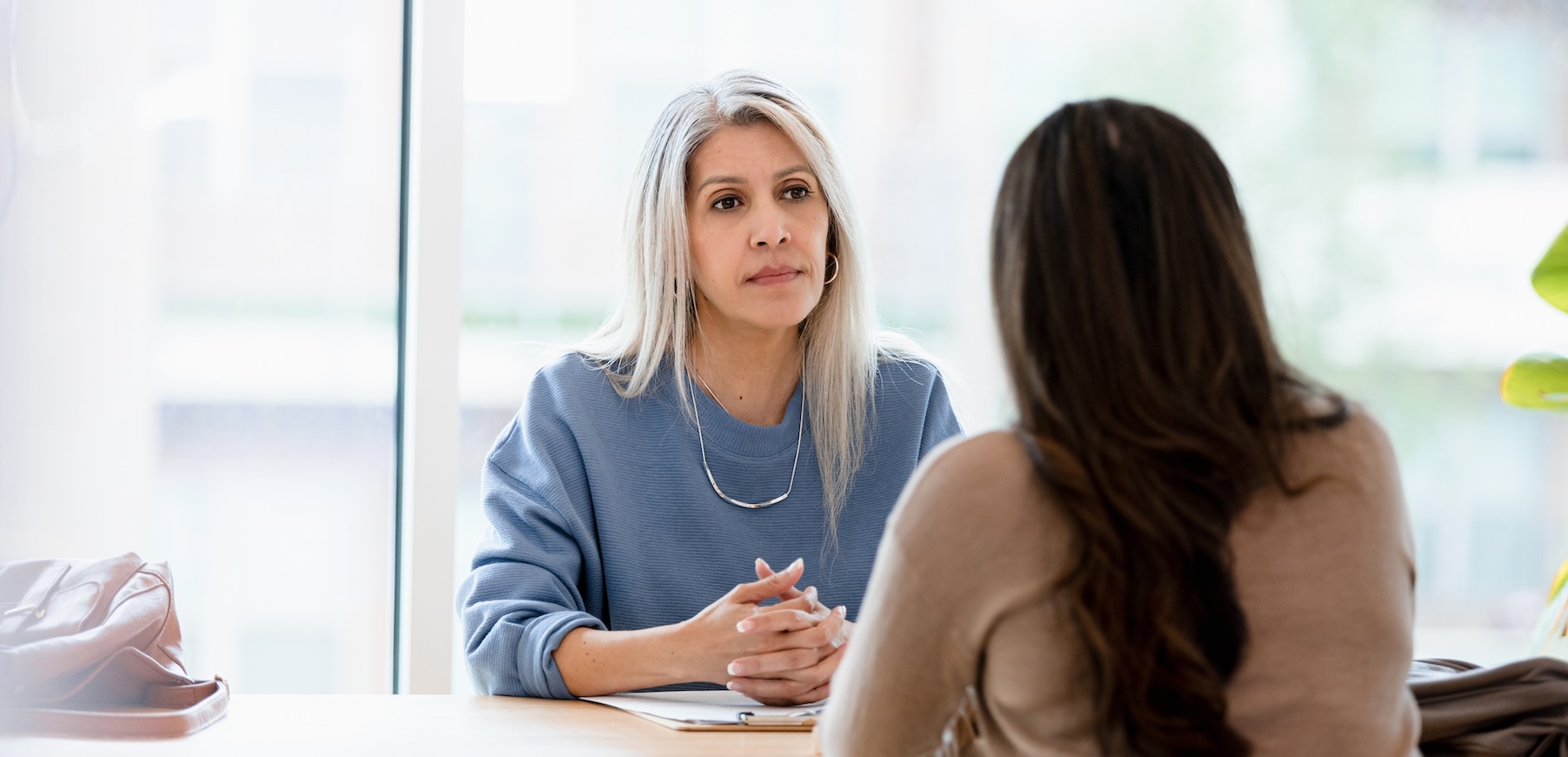 woman listening to an employer with attention