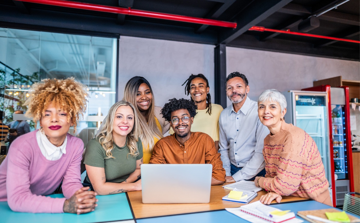 a group of colleagues from all sorts of backgrounds and traits in a safe working environment 