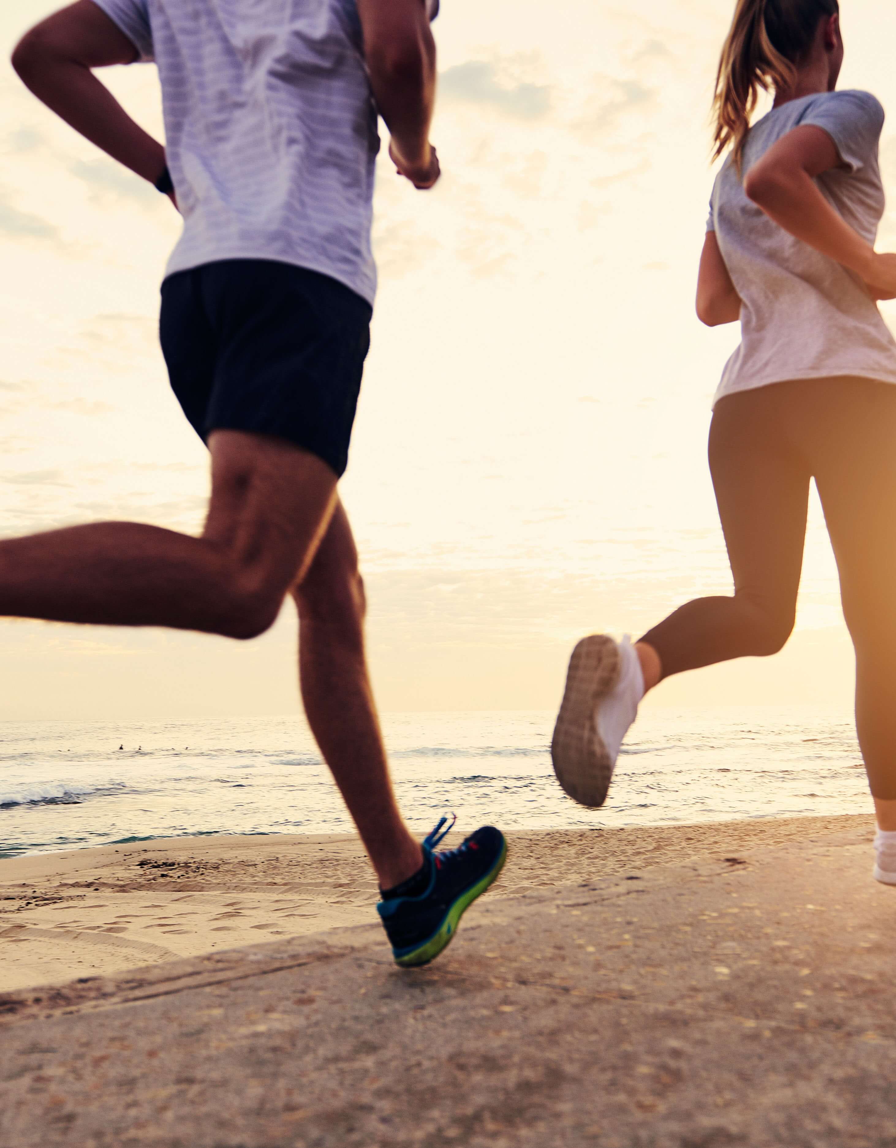 runners on the beach